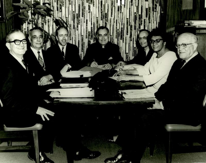 Photograph of Dr. Garcia meeting with fellow USCCR members. 