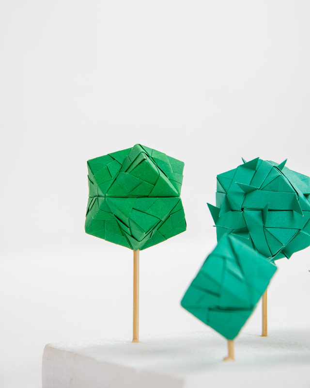 Various color green origami orbs. 