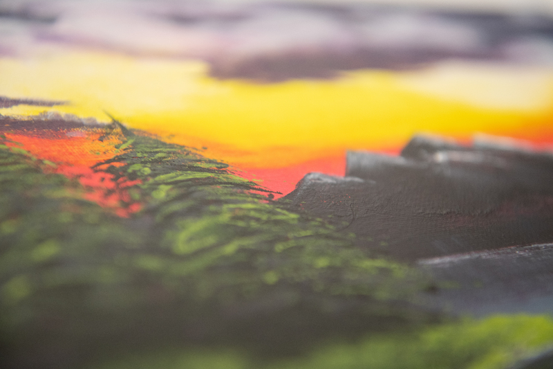 A close up of a painting of a tree and mountain. 