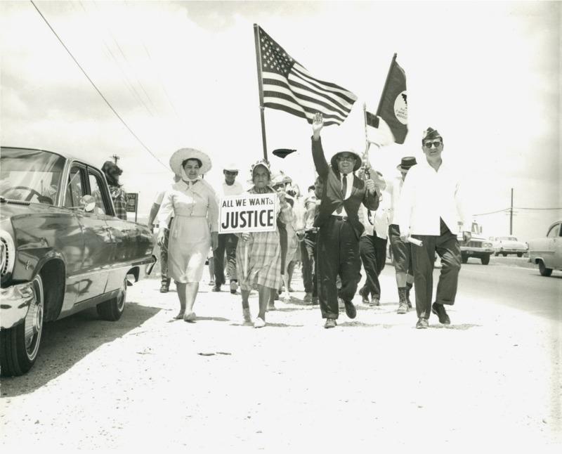 Photograph of Dr. Garcia and his sister Clotilde participating in a march to demand rights for farm workers. 