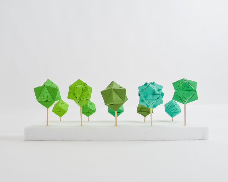 Various color green origami orbs. 