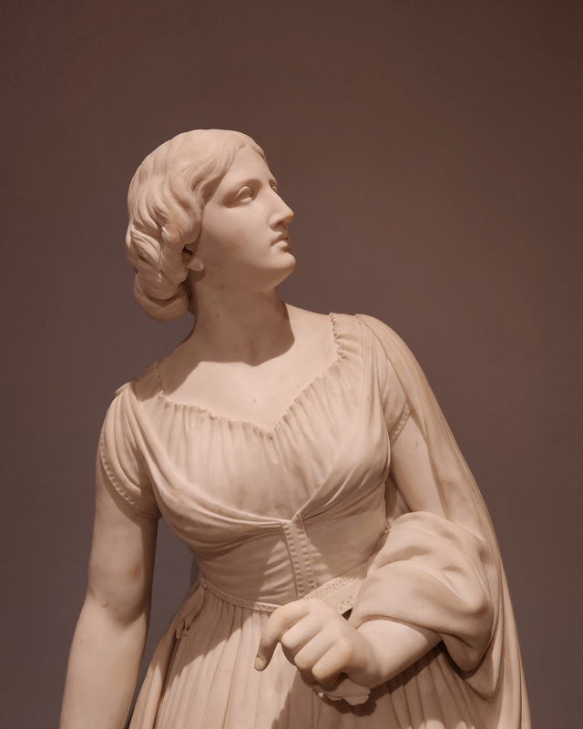 photograph of a sculpted figure of a woman