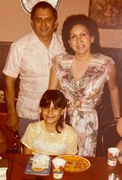 Arturo and Marie Vasquez, with their youngest child, Vanessa, at her 10-year-old Chucky Cheese birthday party.