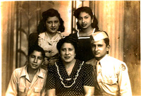 Arturo Vasquez in his Army uniform posing with his mother and siblings.
