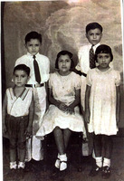 Arturo Vasquez posing for a photo with his siblings, Enrique, Altagracia “Yayita”, Rodolfo, Jr. "Fito", and Gloria Alicia "Lecha"