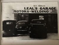 Black and white photograph of Leal's Garage.