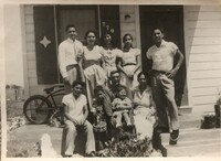 Arturo and Marie Vasquez with Leal family. Black and white photograph. 