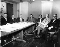 Arturo Vasquez and CCISD School Board Trustees. Dr. William Morris, B.F. Harrison, Ray Edson, Tom Browne, Arturo Vasquez, Jack Ryan, and Fred Sanders sitting at table.