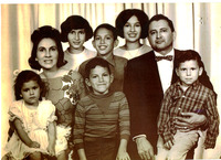 A family portrait of Marie and Arturo Vasquez with their children.