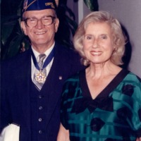 Photograph of Dr. Garcia and his wife Wanda with Dr. Garcia's Medal of Freedom. 