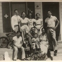 Arturo and Marie Vasquez with Leal family. Black and white photograph. 