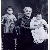 Black and white photograph of baby Altagracia “Yayita" Vasquez, great-grandmother Altagracia Saenz Garcia, and baby Rodolfo Vasquez, Jr. "Fito".