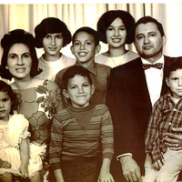 A family portrait of Marie and Arturo Vasquez with their children.